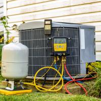 HVAC unit being upgraded by an HVAC service technician