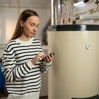 residential boiler repair pictured with concerned boiler basement resident